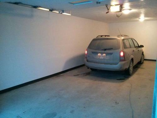 picture of one little car in the big garage