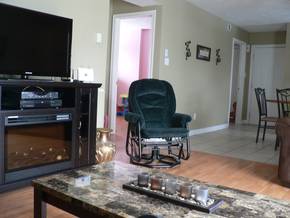 Looking from the chesterfield to the second bedroom, which in an empty nester or single set-up incidentally could very well serve as an office as well.